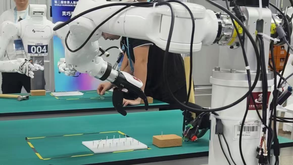 Dexterous robot hand performing the nail fastening task at the 2026 World Humanoid Robot Games